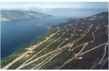 Close to Athens 30 Ha waterfront land approved for the development of a resort, yacht marina and villas for sale in MAINLAND GREECE, 90 km. FROM ATHENS AIRPORT